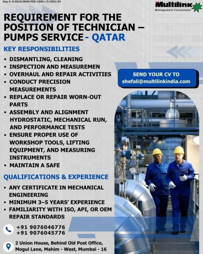 Technician working on industrial pumps in a workshop setting
