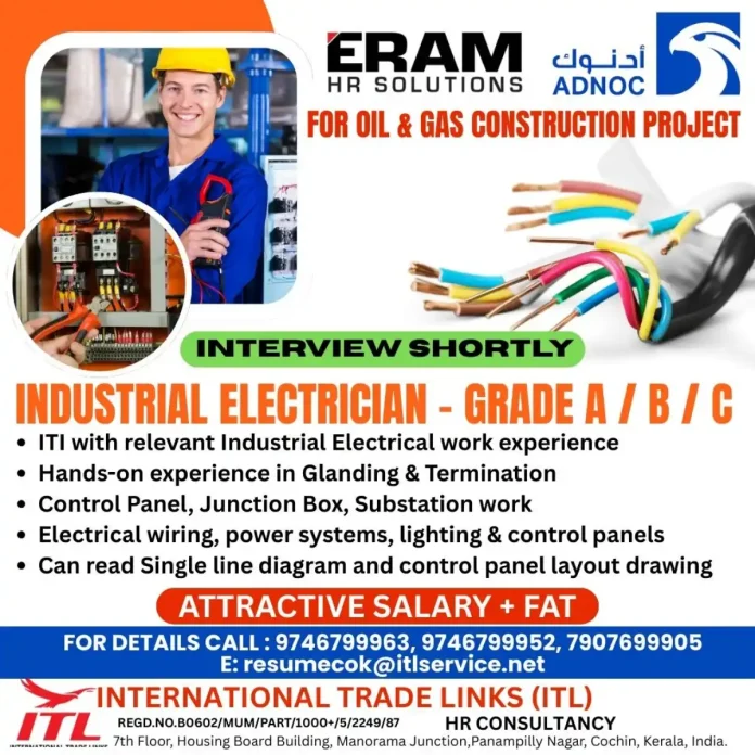 Industrial Electrician working on control panel at ADNOC Oil & Gas Project
