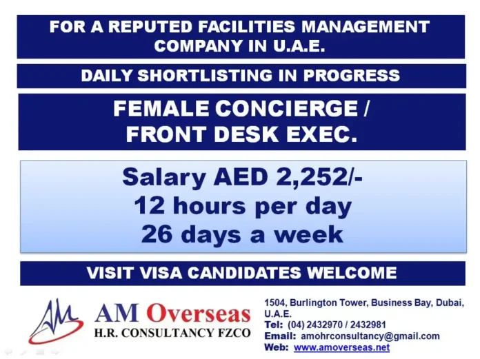 Female Concierge assisting at front desk in Dubai