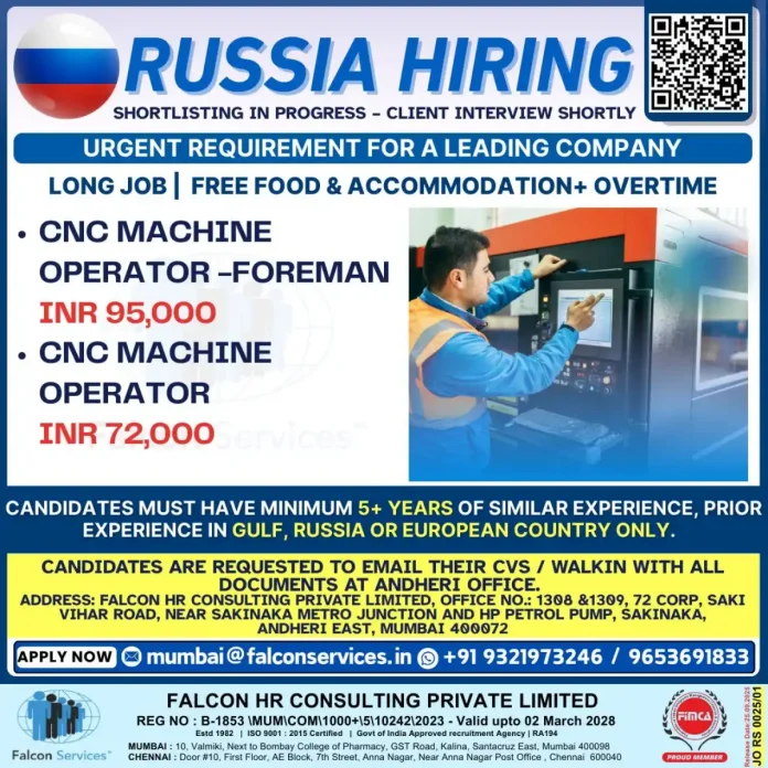 CNC Machine Operator working on industrial equipment in Russia