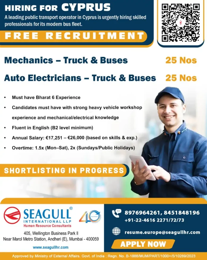 Mechanic and auto electrician working on a bus in Cyprus