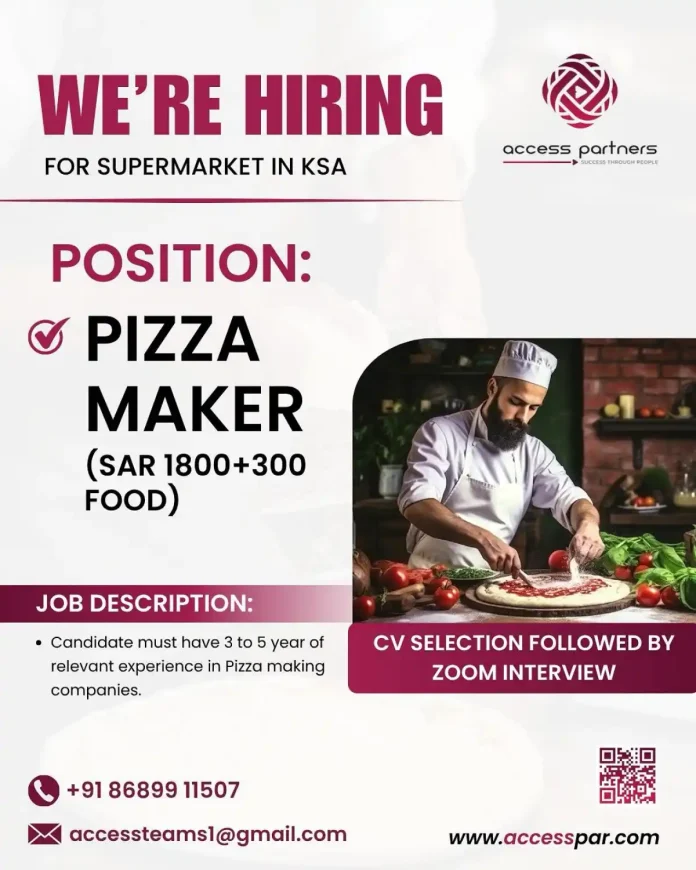 Pizza Maker preparing pizza in a supermarket kitchen in KSA