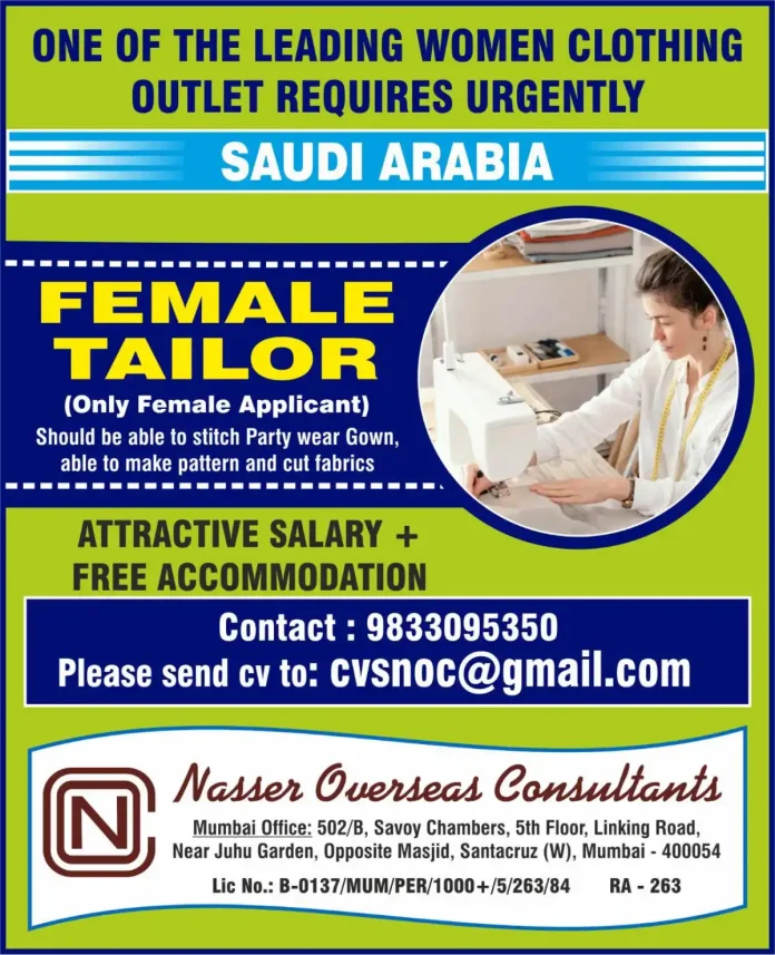 Female tailor stitching a party wear gown in a professional setting