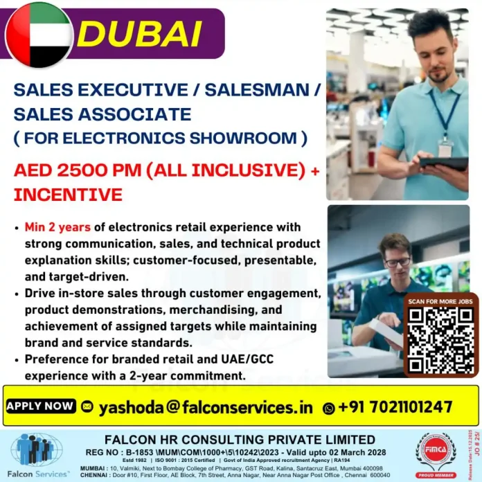 Sales professional assisting customer in electronics showroom Dubai
