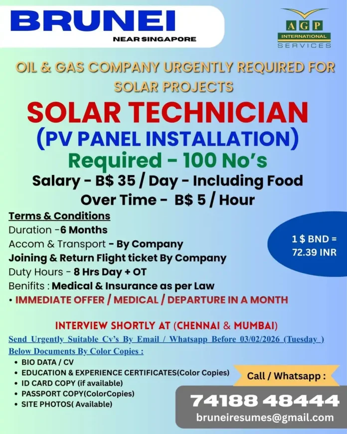 Solar Technician installing photovoltaic panels on rooftop in Brunei