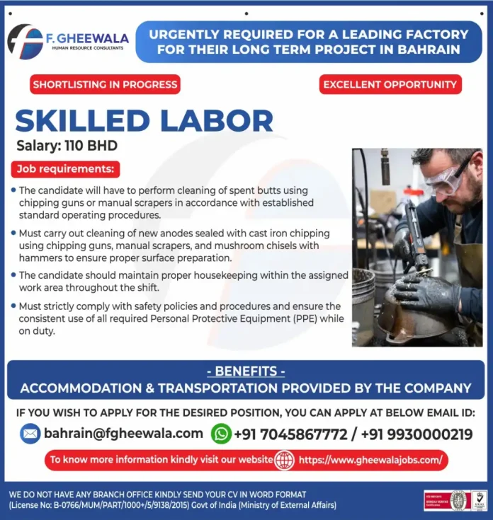 Skilled labor worker performing anode cleaning in a factory setting