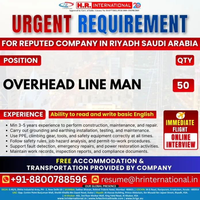 Overhead Line Man working on power lines in Saudi Arabia