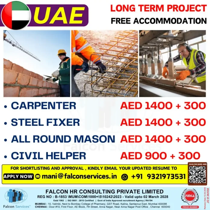 Skilled construction workers including carpenter and steel fixer on site in UAE