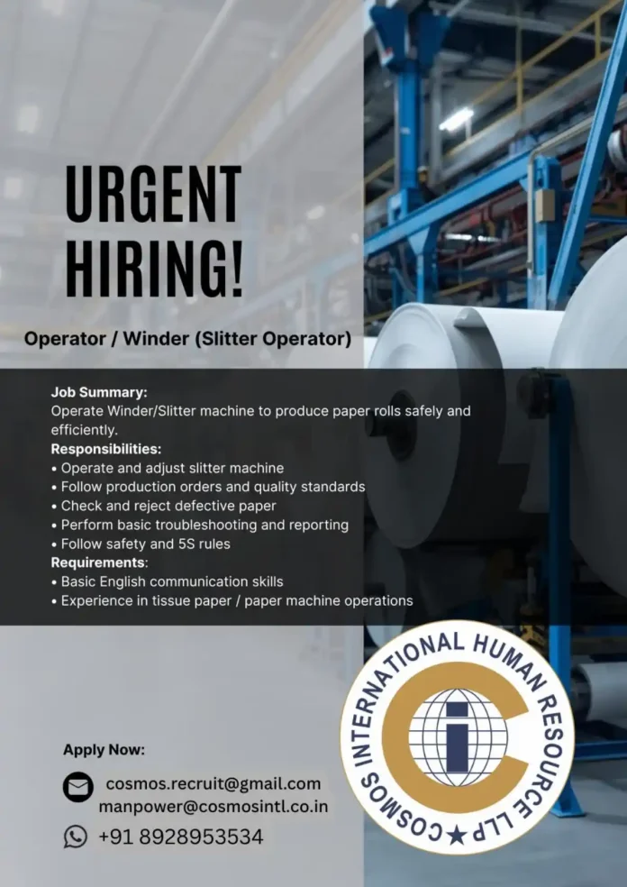 Operator working on Winder Slitter machine in paper manufacturing facility