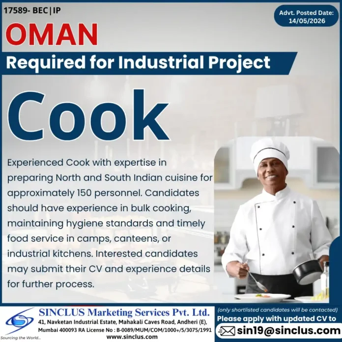 Cook preparing Indian cuisine in industrial kitchen