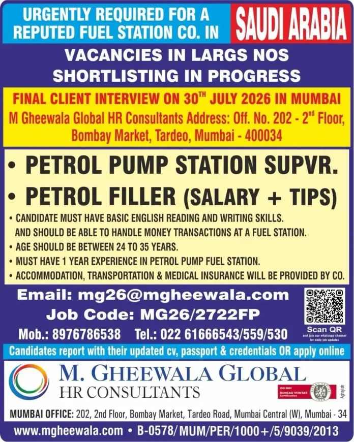 Petrol pump workers at a fuel station in Saudi Arabia