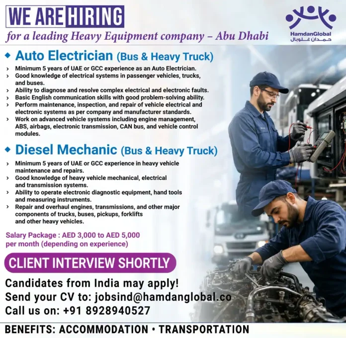 Heavy equipment Auto Electrician and Diesel Mechanic working on a bus engine in Abu Dhabi workshop