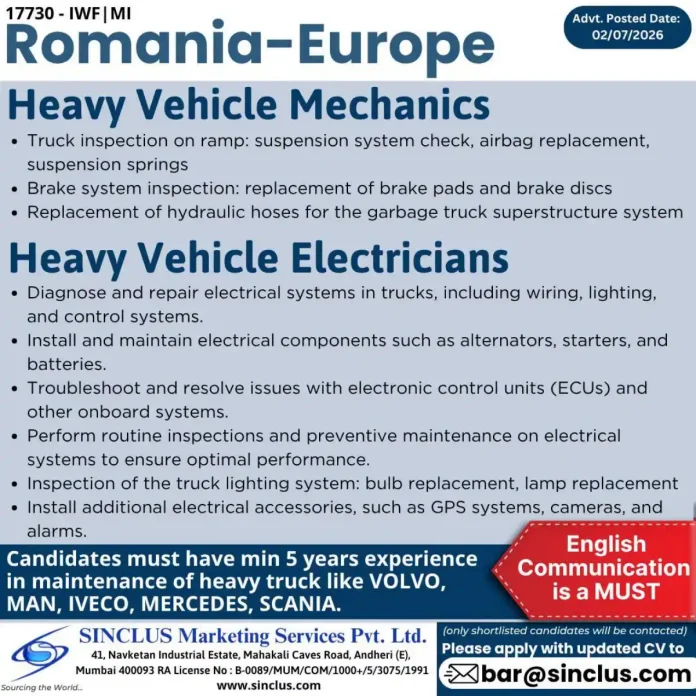 Heavy vehicle mechanic inspecting truck suspension on ramp