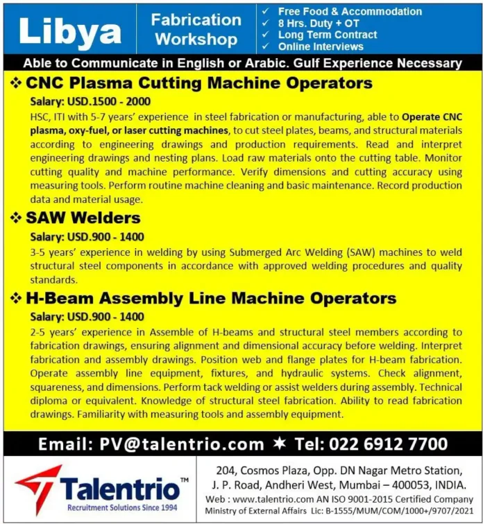 Steel fabrication workers at Libya workshop operating CNC plasma cutting machine